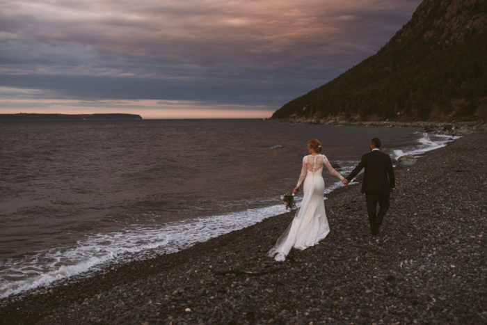 Bride and Groom walk Topsail Beach, Newfoundland and Labrador during sunset