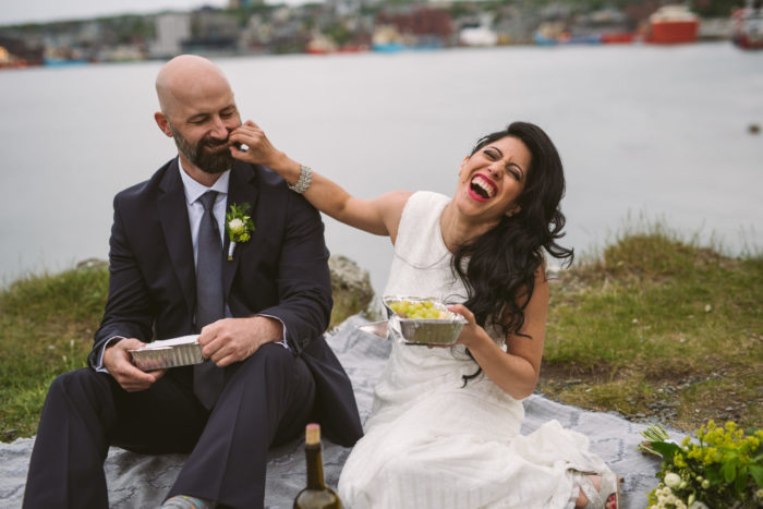 Chef bride and husband enjoys a oceanside picnic on their wedding day.