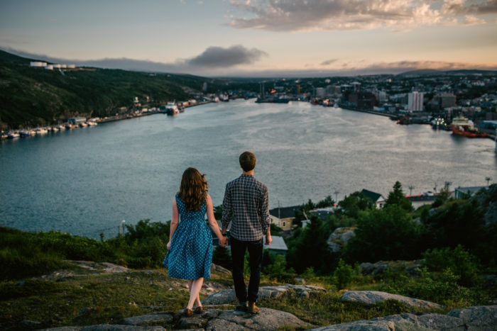 Couple walks towards St. John's Harbour during an engagement session in Newfoundland and Labrador