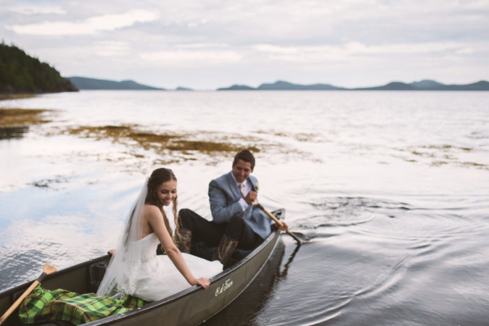 Bride and Groom canoe after outdoor wedding in Lewisporte Newfoundland and Labrador