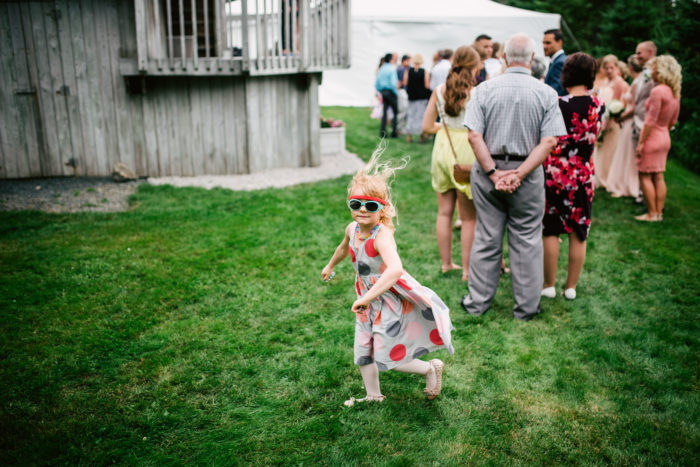 Little girl makes her own fun during a backyard wedding in St. John's Newfoundland and Labrador