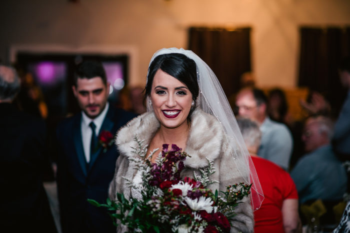 Bride enters reception hall during wedding in Twillingate Newfoundland and Labrador