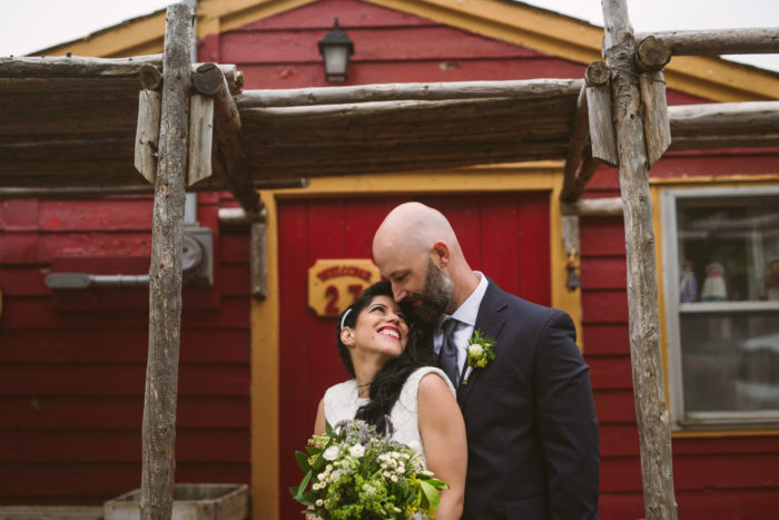 Gazing into each others eyes in front of a fishing stage, The Battery, St. John's Newfoundland and Labrador