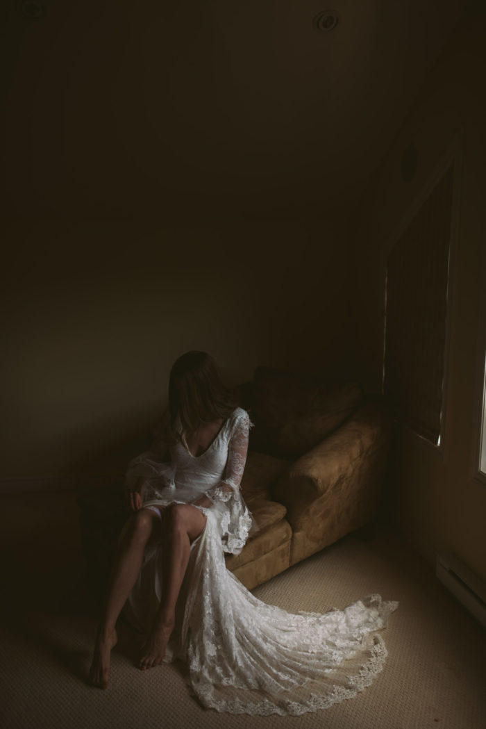 Bohemian Bride puts on garter while getting ready for her wedding in Pasadena Newfoundland and Labrador