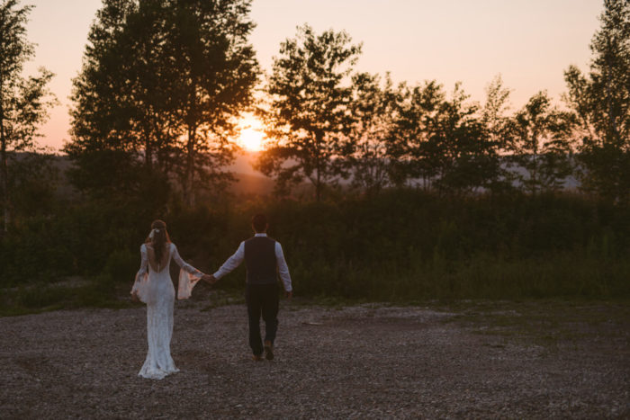 Bohemian Bride and Groom head towards sunset in Pasadena Newfoundland and Labrador