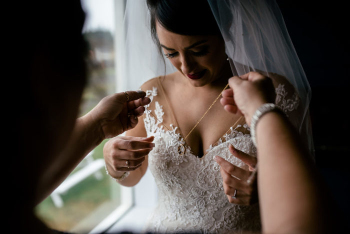 Mother gives bride a new necklace for wedding day in Twillingate Newfoundland and Labrador