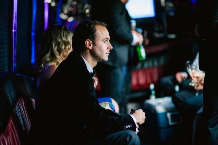 Groomsman sits on party bus during brothers wedding day in St. John's Newfoundland and Labrador